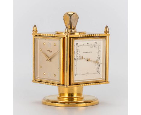 A weather station with thermometer, hygrometer, barometer and clock marked Imhof.Condition: Barometer glass corner broken. Cl