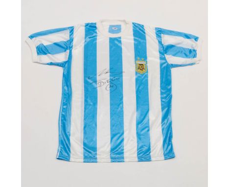 A signed Argentina shirt by Diego Maradona and in black sharpie, rating 9.5/10. The signature is authenticated and databased 