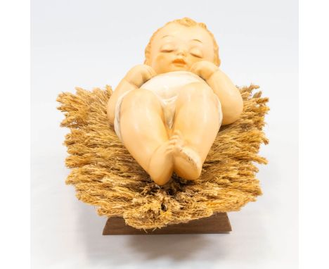 A Hummel porcelain statue of baby Jesus lying in the crib, 78 VI. (13 x 27,5 x 10 cm)