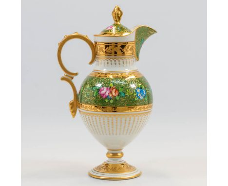 A pitcher with lid and hand-painted flower decor, finished with green and gold tints, marked Limoges, France. The second half