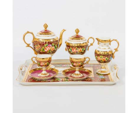 A porcelain coffee and tea service Tte a Tte with hand-painted flower decor and marked Giraud Limoges. Condition: One handle 