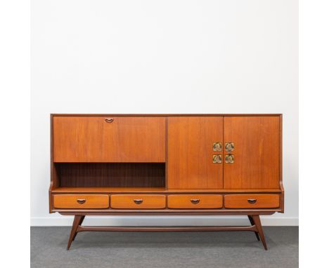 Louis VAN TEEFFELEN (1921-1972) A sideboard made of teak with drawers, a bar and finished with ceramic tiles. Around 1950-196