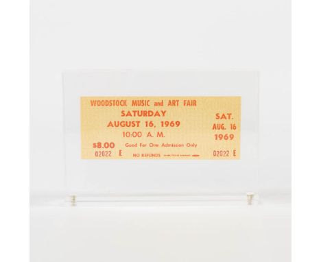 An original Woodstock music festival ticket, unused, in a magnetic plexi frame. Accompanied by a copy letter of Globe printer