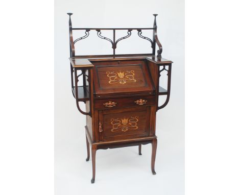 An ornate Shapland & Petter Art Nouveau, walnut, slope front bureau inlaid with pewter and exotic woods, the interior with a 