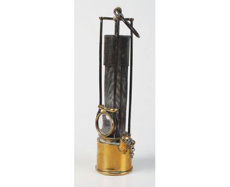 An rare early 19th century Davy lamp with a cage of four steel bars protecting the gauze,  the front accommodates a magnifyin