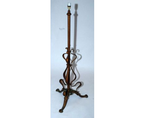 An Art Nouveau brass tripod standard lamp base.