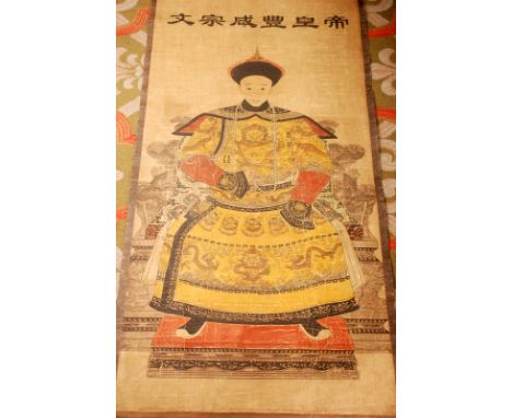 A Chinese scroll portrait of the young seated Emperor Xianfeng (1851-1861) in yellow gown. length 125cm, width 61cm.