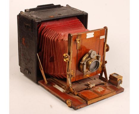 A 19th century Sanderson Regular Model plate camera with red leather bellows and mahogany front and base with brass mounts, t