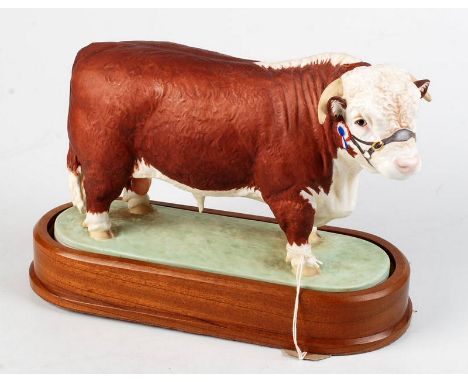 A Royal Worcester Hereford bull modelled by Doris Lindner. Hardwood stand. Height 27.2cm. Condition Report: Good condition
