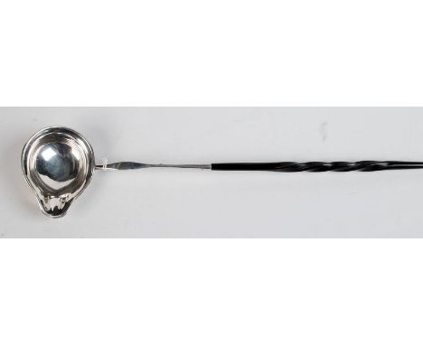 A Georgian silver coloured metal single lipped punch ladle with spiral whalebone handle, unmarked, together with a second pun