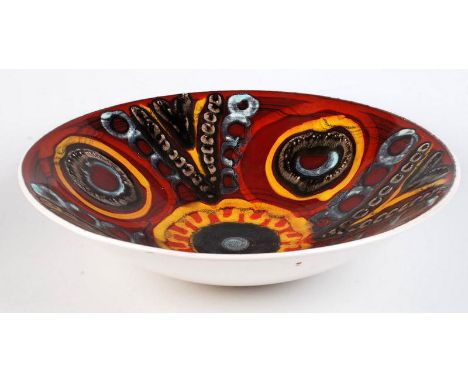 A Poole Delphis pottery red glazed bowl patterned with an abstract design, diameter 34.5cm.