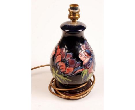 A blue ground Moorcroft "Anemone" pattern table lamp, height including wooden base but excluding fitting 22.5cm. Condition Re