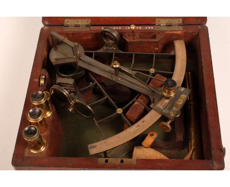 A sextant by Ross, London with an inset silver scale. The mahogany case with a near full compliment of accessories.