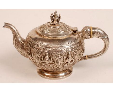 An early 20th century Indian, silver coloured, 'swami-ware' metal teapot of bulbous circular form resting on a pedestal foot,