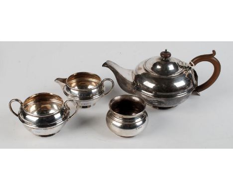 A three piece silver tea service of bulbous, ribbed circular form, by S.W. Smith & Co., Birmingham, 1917, 24.3ozt. Together w