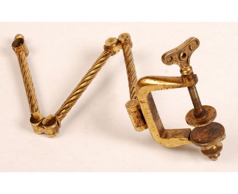 A 19th century brass face screen bracket with table clamp.