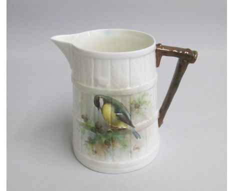A Royal Worcester Barrel Shaped Jug painted with a Great Tit signed by D Jones.Date: coded 1952  Green markSize: 11cm highCon