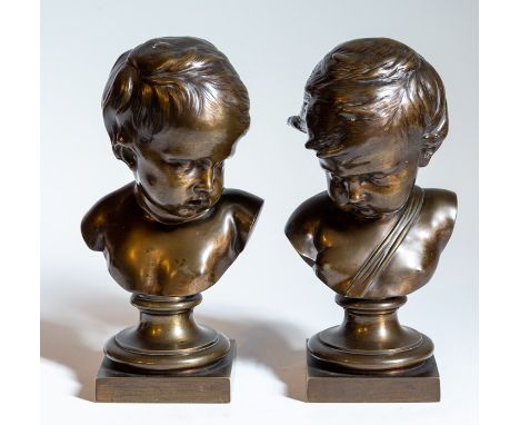 A pair of bronze busts of children, each measuring 26cm high (2)
