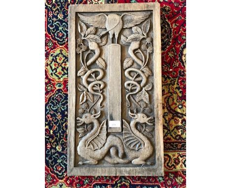 A 20th century Arts &amp; Crafts carved oak wall panel, depicting exotic bird, dragons and snakes in a forest scene. 60cm H x