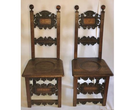 A pair of 19th Century Italian oak and satinwood inlay hall chairs, globe shaped finials on square support back centred with 