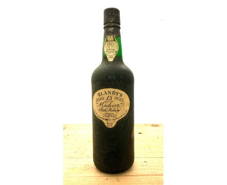 A selection of bottle to include Four Bells Navy rum, QE2 Blended Scotch Whisky, Old Hopking White rum and Blandy's 15 year o