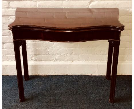 A George III mahogany card table, circa 1770, in the manner of Thomas Chippendale,&nbsp;serpentine hinged fold-over top with 