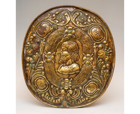 A 17th Century repousse brass wall sconce back plate, central oval portrait medallion of a bearded man in profile, the border