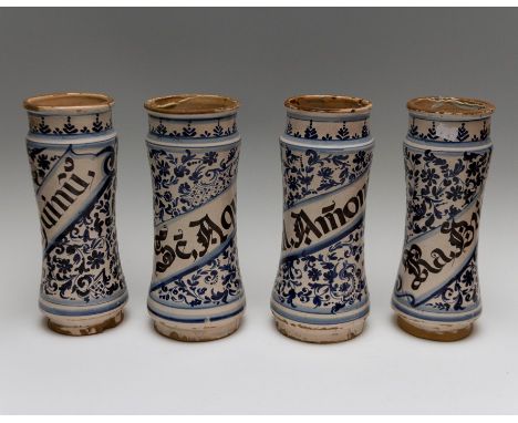A set of four faience albarello or wet drug jars, 16th Century, each named within a banner, 'Sal Amonia', 'Ra Brionia', 'Benj