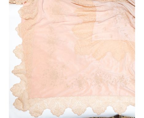 A large silk pale pearl bedspread 1930s/40s edged in a coffe lace scalloped edging, lined. The bedspread in decorated in embr