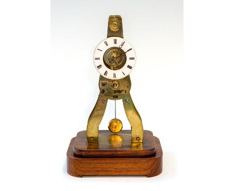 A late 19th Century small French brass skeleton clock signed Ms Honorables, Paris &amp; Londres, 5cm white enamel chapter rin