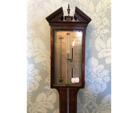 A 19th Century mahogany and strung mercury stick barometer, broken pediment with urn finial, rectangular silver gauge signed 