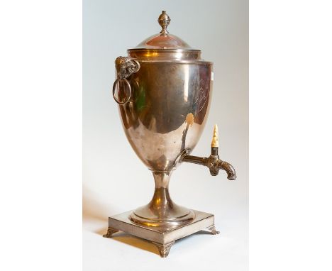 A George III Sterling silver tea urn, London 1790, makers mark for James Young, rams head handles, ivory tap handle, engraved