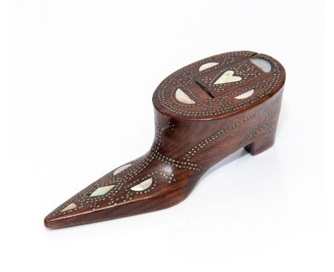 An early to mid 19th Century treen shoe snuff box, inlaid mother of pearl heart, other devices and brass tack, sliding cover,