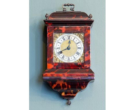 A miniature tortoiseshell bracket timepiece, of Georgian design, caddy top with white metal swing handle and flame finials, 7