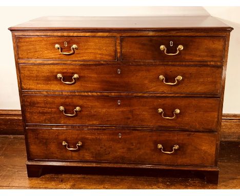 A George III mahogany chest of drawers, circa 1800, rectangular moulded edge top above two short and three long graduated dra