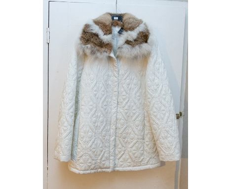 A white padded 3/4 jacket, perfect studded and zipped design. St. Martin's Black Velvetine jacket with black and white quilte