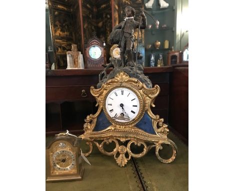 A 19th Century spelter and gilded figural mantle clock, with a white enamelled dial, together with a miniature mantle clock (