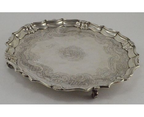 A George IV circular silver salver, pie crust border and shell border,&nbsp; scroll engraved bed and heraldry, maker J.E. Ter