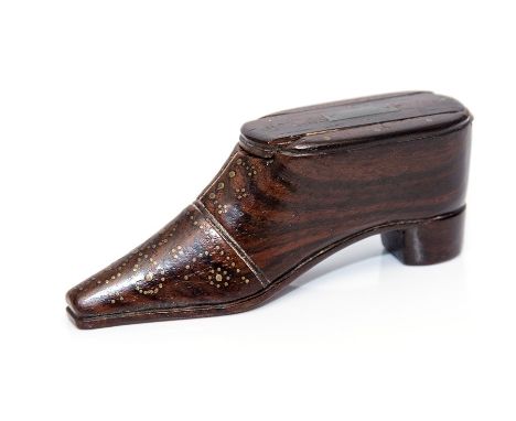 A mid 19th Century treen shoe snuff box, inlaid brass tack and lead cartouche to the sliding cover, width 11cm