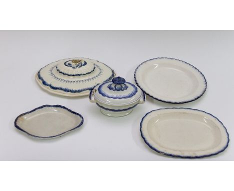 A group of early nineteenth century blue painted shell edge pearlware pieces, circa 1820-30. Comprising of: four platters (on