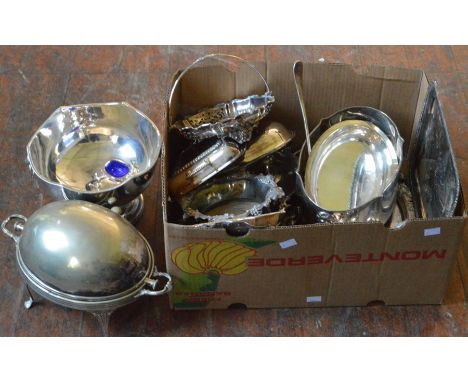 A collection of assorted Old Sheffield plate and later silver plated ware, including chambersticks, decanter coasters, tureen