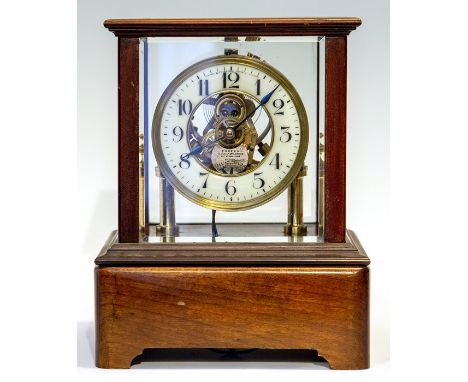 An early 20th Century Century Eureka electro-magnetic bracket clock, glazed case, Arabic numeral dial, bi-metal balance with 