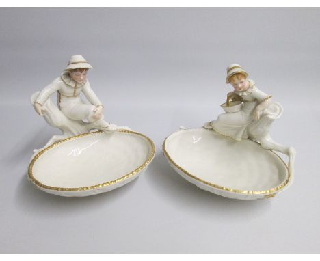 A pair of Fine Royal Worcester Figural Comports depicting a Boy and a Girl in  a Hadley style sitting in a branch.Date: code 