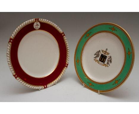 Two nineteenth century porcelain armorial plates, circa 1850-80. Comprising: a Worcester plate with gadrooned rim, a puce gro