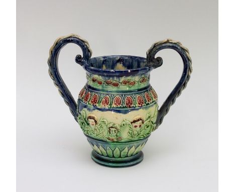 A late nineteenth century Castle Hedingham Pottery Art Pottery two-handled vase, circa 1880. It has applied decoration of thr