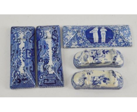 A group of four early nineteenth century blue and white transfer printed knife rests, circa 1810-30. Included: a Spode Greek 