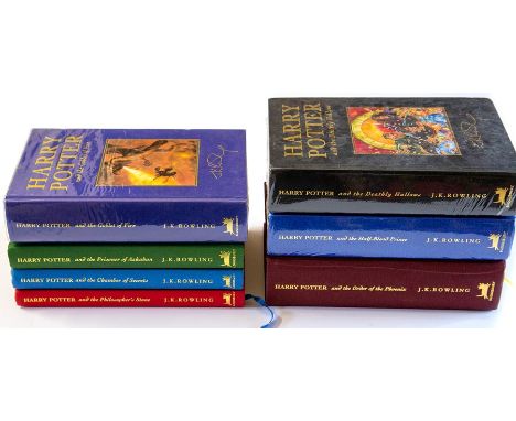 Rowling, J. K. Set of seven Harry Potter deluxe editions: Philosopher's Stone (10th impression); Chamber of Secrets (4th impr