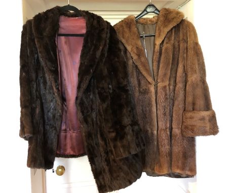 Two fur coats; one dark brown squirrel, early 1950's and a 1950's musquash light brown, turned back cuffs, pockets and trim (