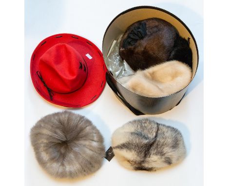 A Collection of fur hats to include a Mitzi Lorenz in shaded fur. A blonde Mink 1960/1970. A grey silver Mink hat, a dark bro