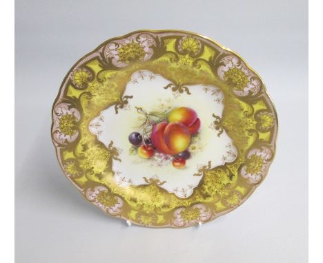 A Royal Worcester Dessert Plate Yellow, Pink and Gilt ground. The centre painted with Peaches and Cherries. Signed by J Freem